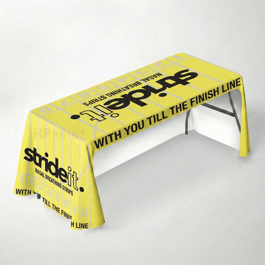 Yellow tablecloth with 'strideit' branding on a white background