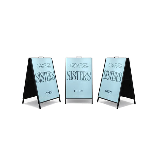 Self Standing Standee Three 'We Are Sisters' signs on a white background