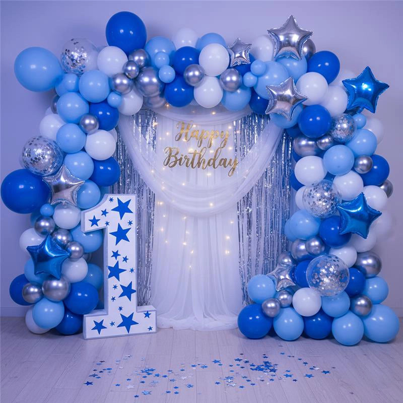 Blue and silver balloon arch with Happy Birthday decoration.