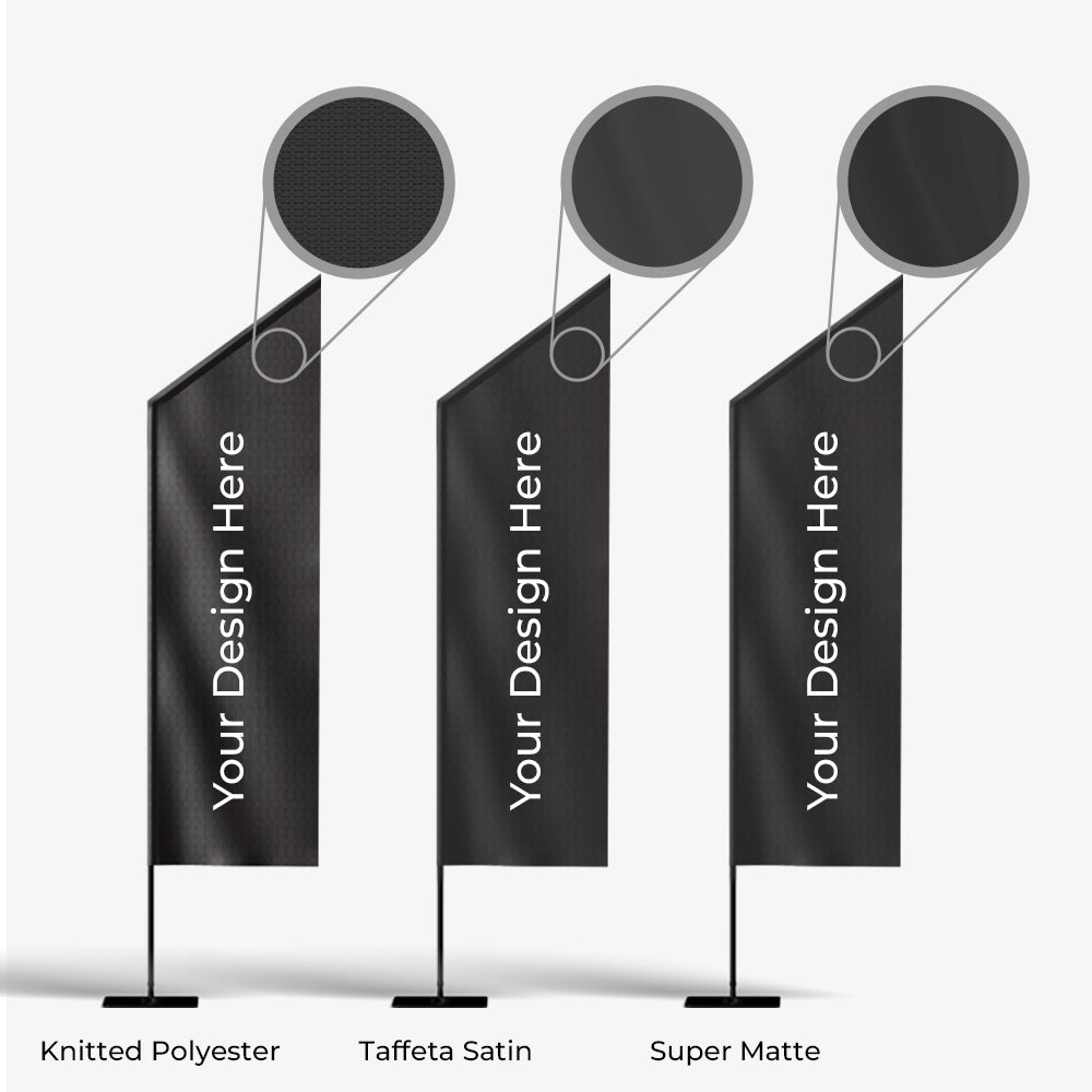 Three black flags with 'Your Design Here' text on a white background, labeled as Knitted Polyester, Taffeta Satin, and Super Matte.