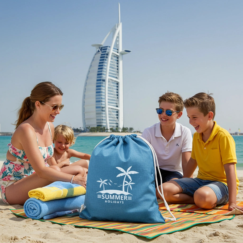 blue drawstring bag on a sunny Dubai beach, with a happy family and the iconic Burj Al Arab in the background.