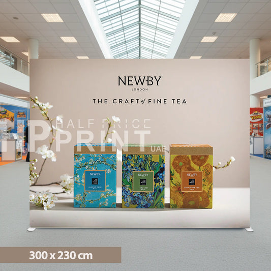 Newby tea packaging display with promotional text in a mall setting