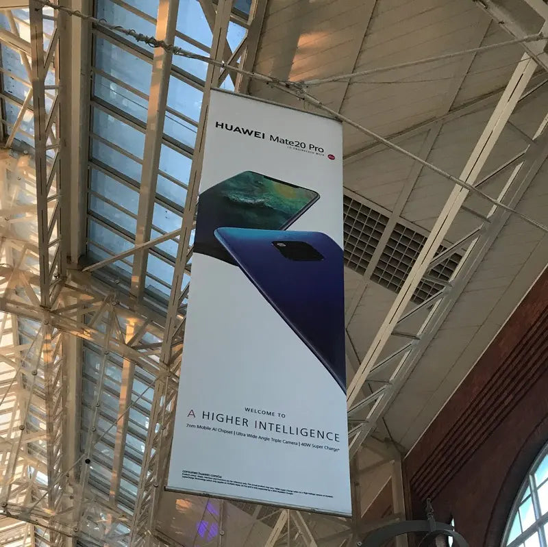 Vertical ceiling hanging banner display for Huawei Mate 20 Pro inside a shopping mall
