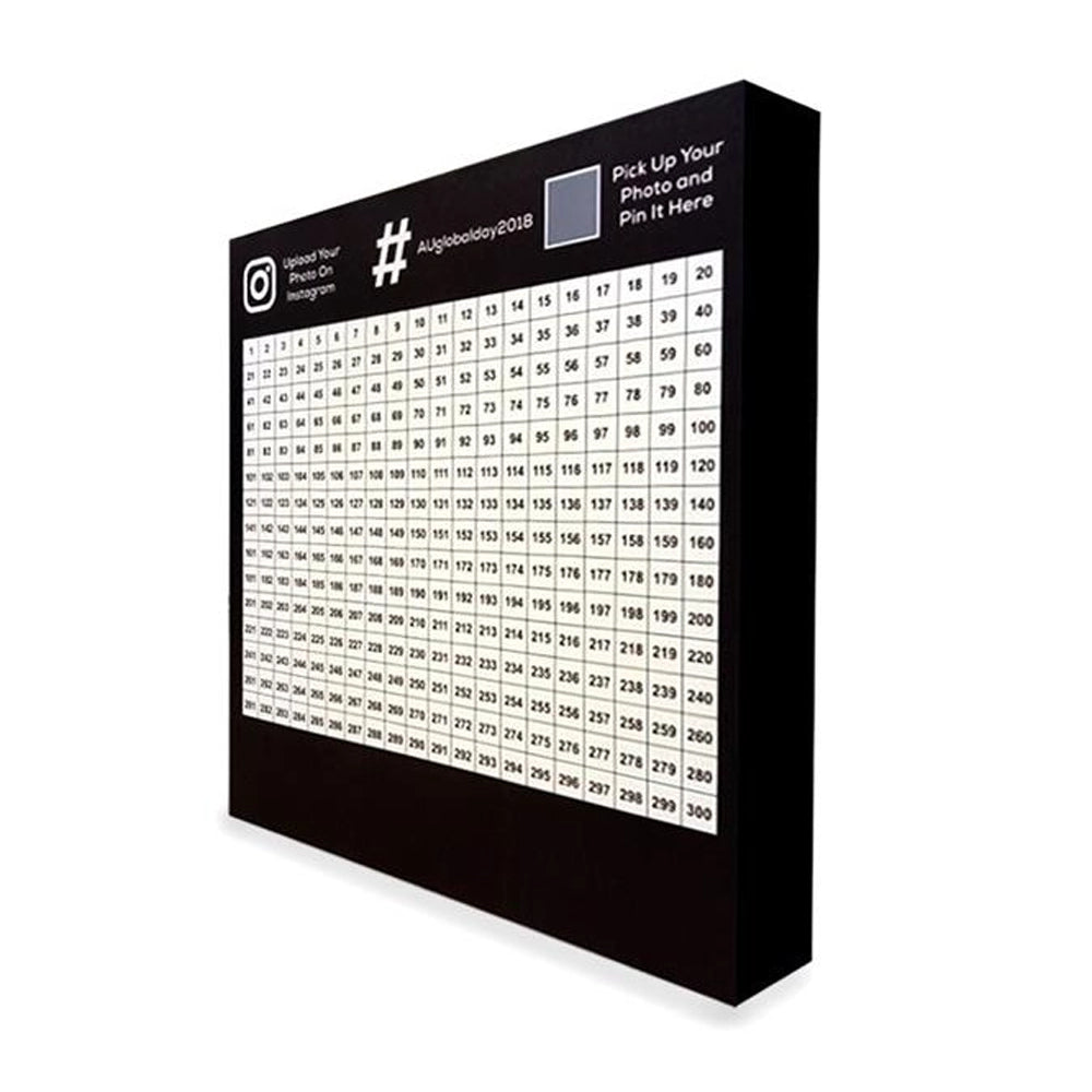A studio backdrop with a mosaic pattern in black and white, with a section #hashtagme and space to add a phone number.