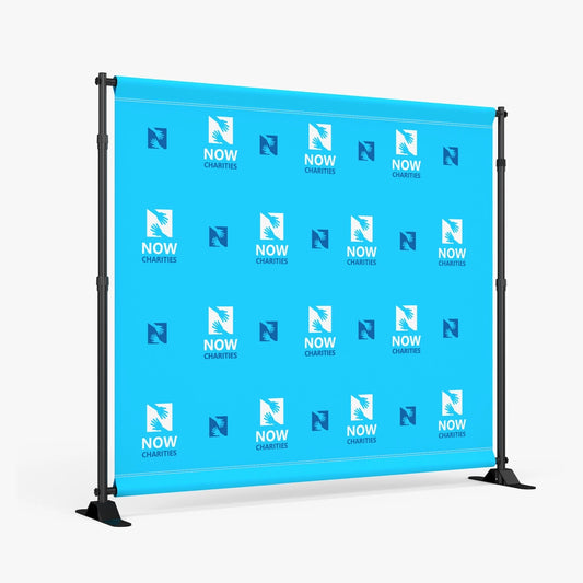 Blue step and repeat backdrop banner featuring a repeating charity logo pattern, mounted on a sturdy freestanding frame for red carpet and event photography.