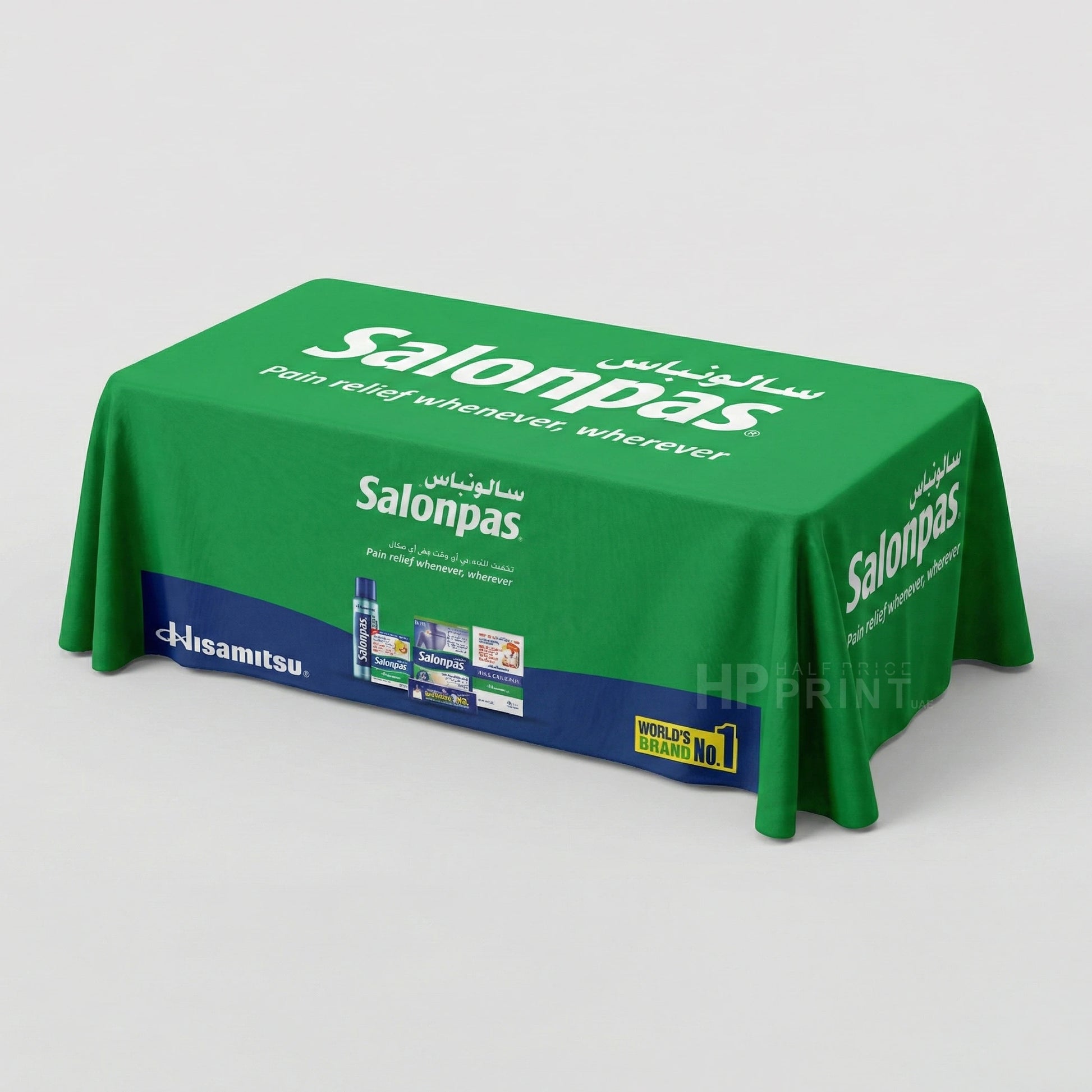 Green Salonpas branded tablecloth on a white background
