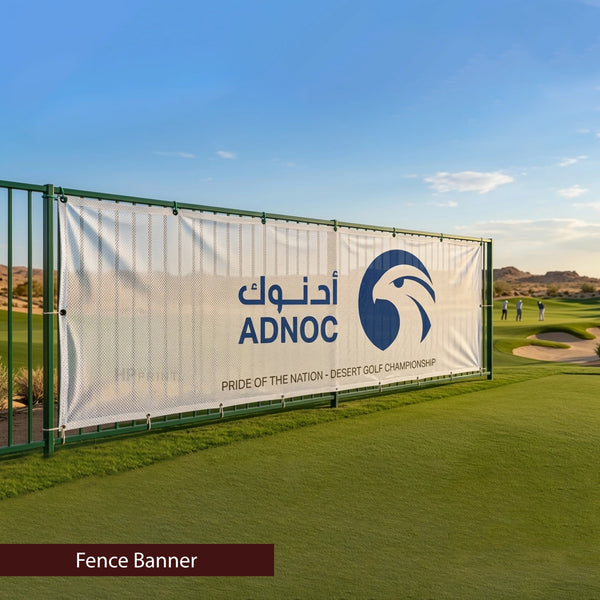 ADNOC fence banner on a golf course with clear blue sky