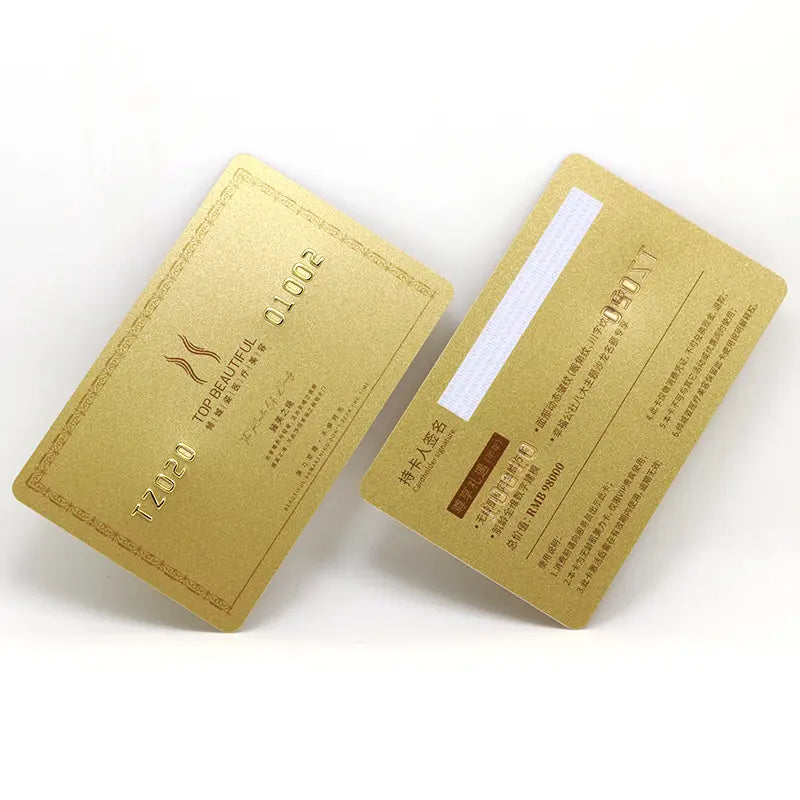 Two gold metallic membership cards displayed at an angle on a white background, featuring embossed numbers, Chinese text, and a white magnetic stripe on the back.