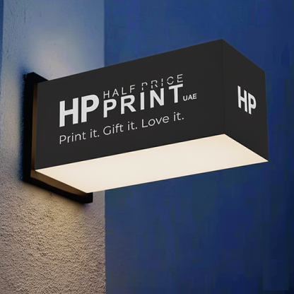 Acrylic light box with Half Price Print logo on a wall with blue and gray background
