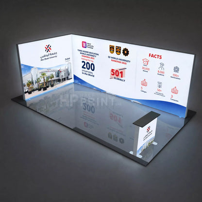 Backlit exhibition display stand with text and graphics on a dark background