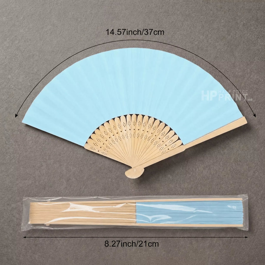 Light blue folding bamboo fan with wooden handle and measurements on a gray background