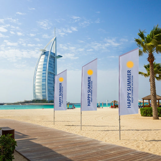 Beach scene with palm trees, 'Happy Summer' flags, and the Burj Al Arab building in the background.