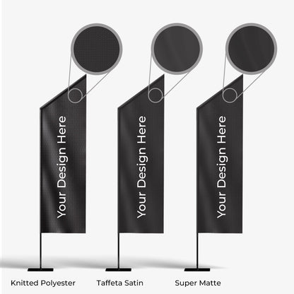 Three black flags with 'Your Design Here' text on a white background, labeled as Knitted Polyester, Taffeta Satin, and Super Matte.