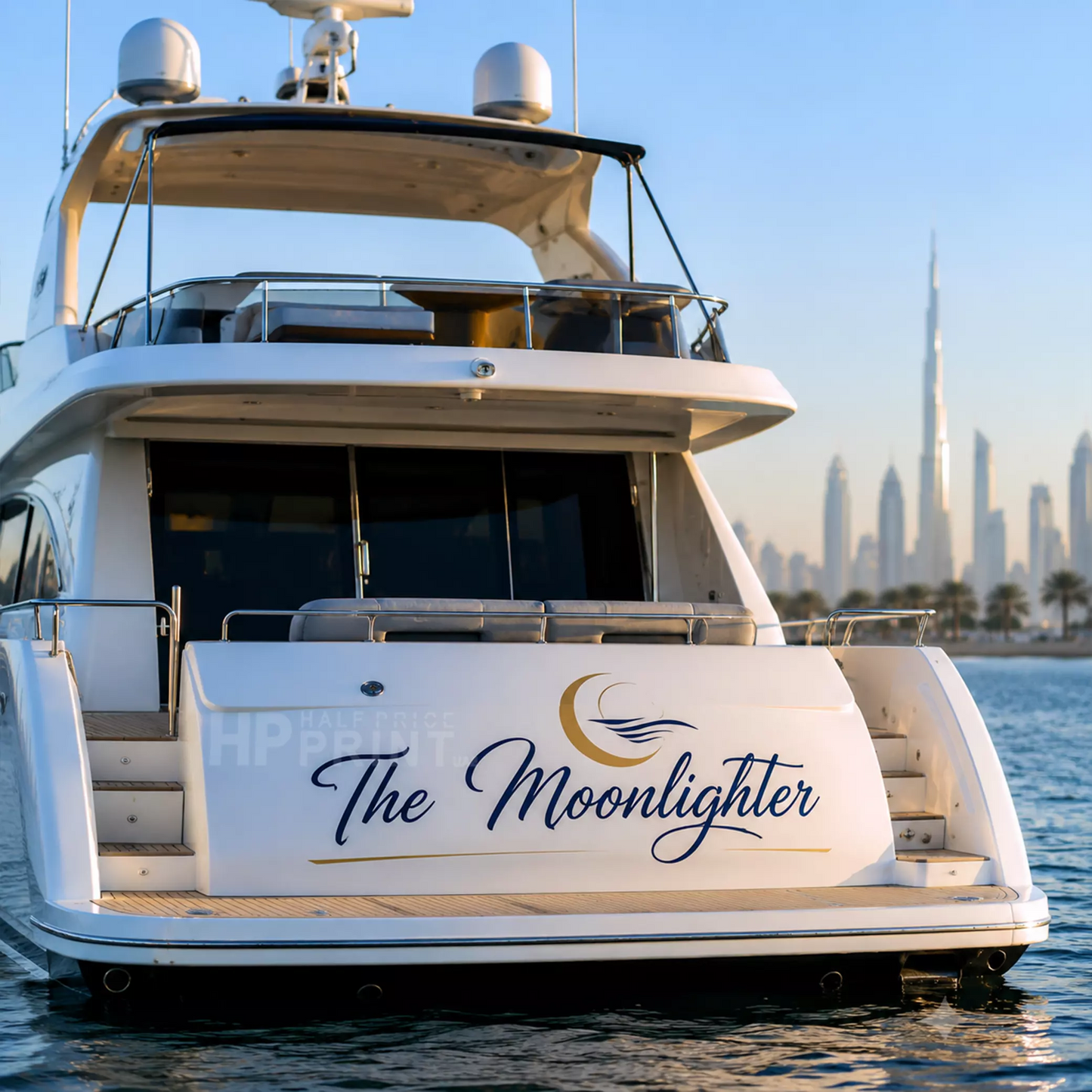 The rear view of a white luxury yacht The Moonlighter Decals with the Dubai skyline and Burj Khalifa visible in the background under a clear blue sky.