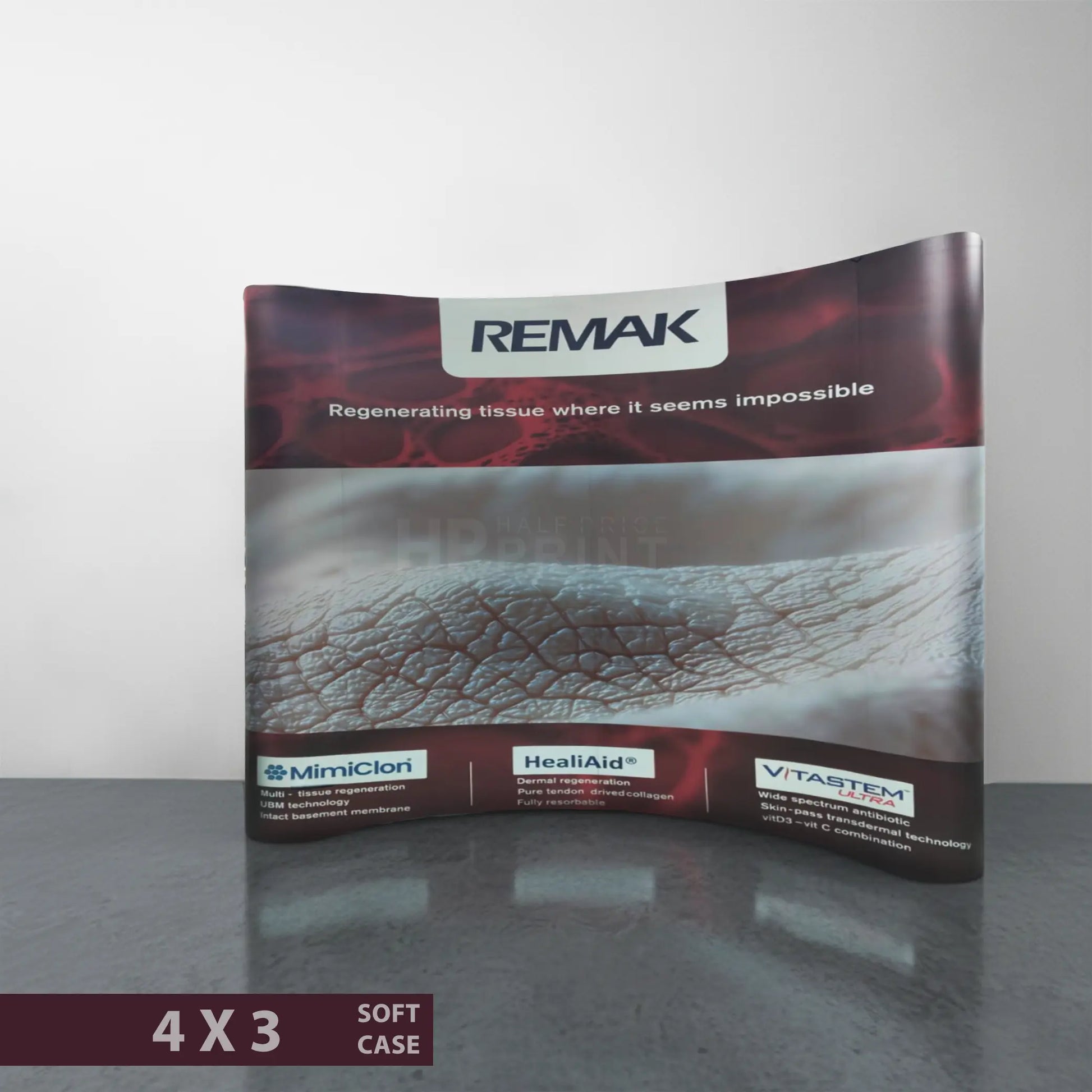 Promotional material for REMAK with branding on pop up curved display