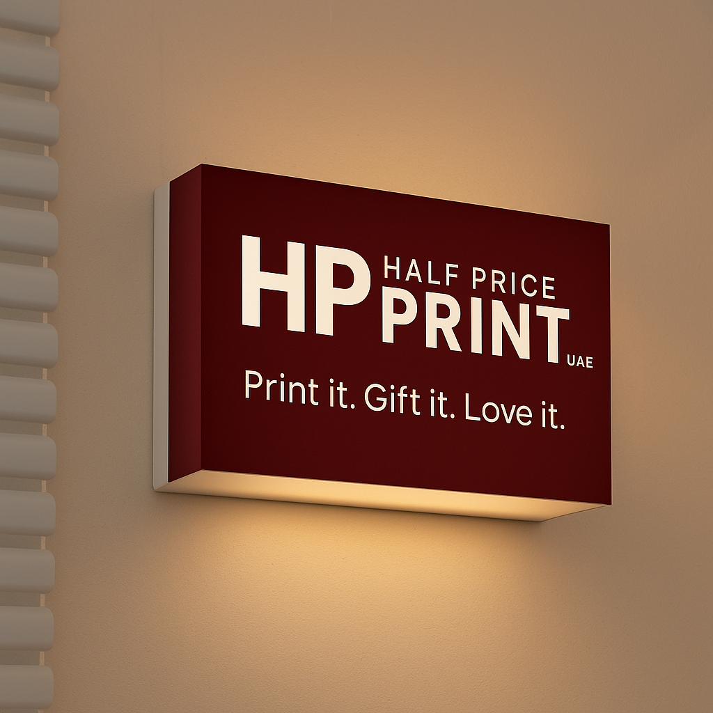 Half Price Print logo acrylic sign on a wall with warm lighting