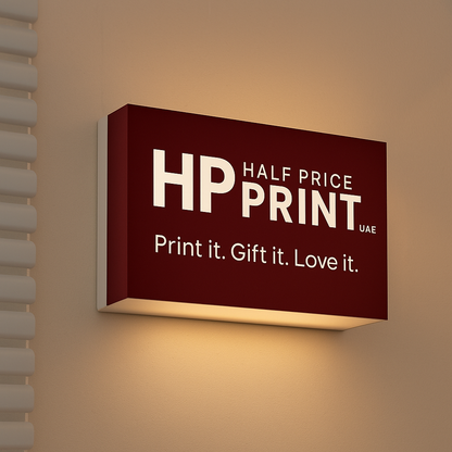 Half Price Print logo acrylic sign on a wall with warm lighting
