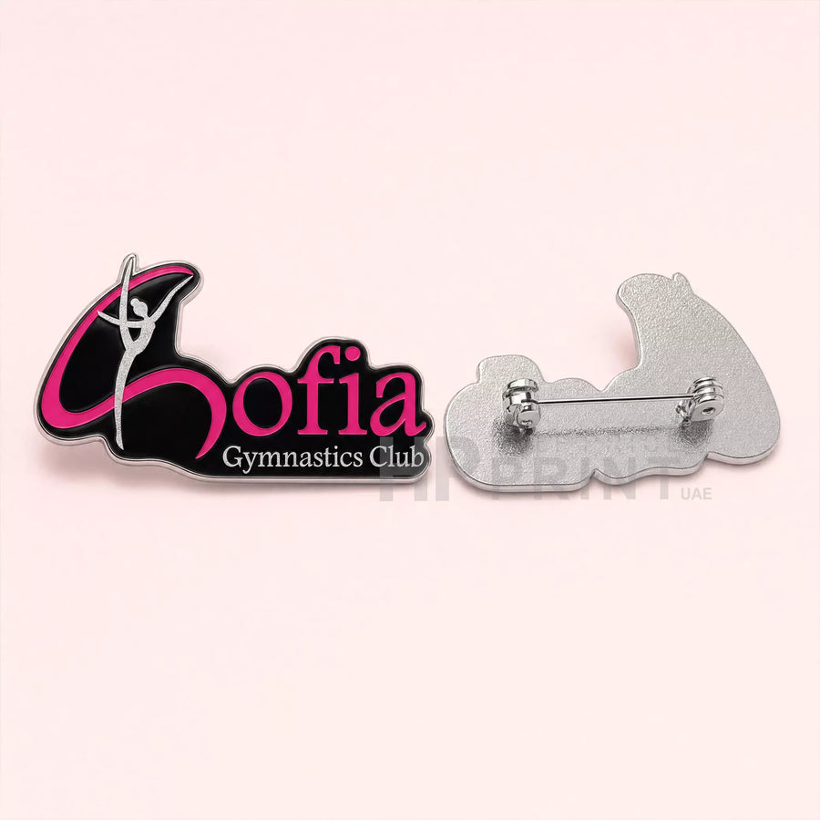 Sofia Gymnastics Club lapel pin with a gymnast silhouette on a pink background