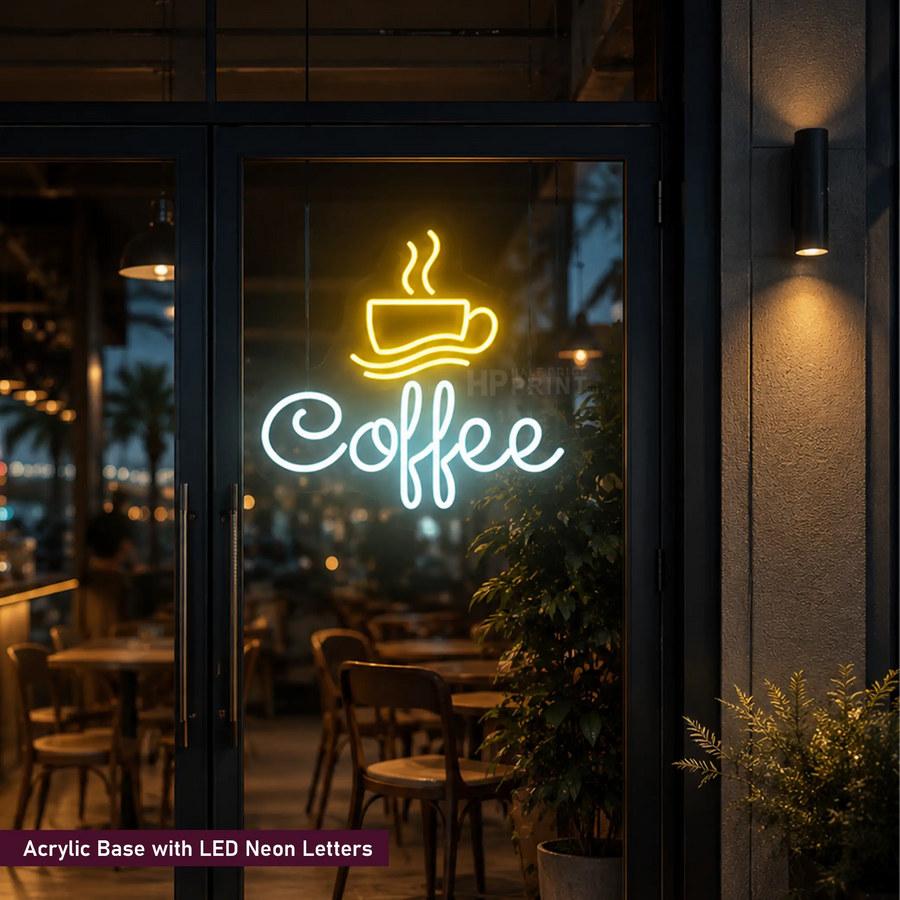 A neon sign on a glass storefront door showing a yellow coffee cup icon above the word "Coffee" in glowing white letters, with a dark cafe interior and outdoor night scene reflected behind it.