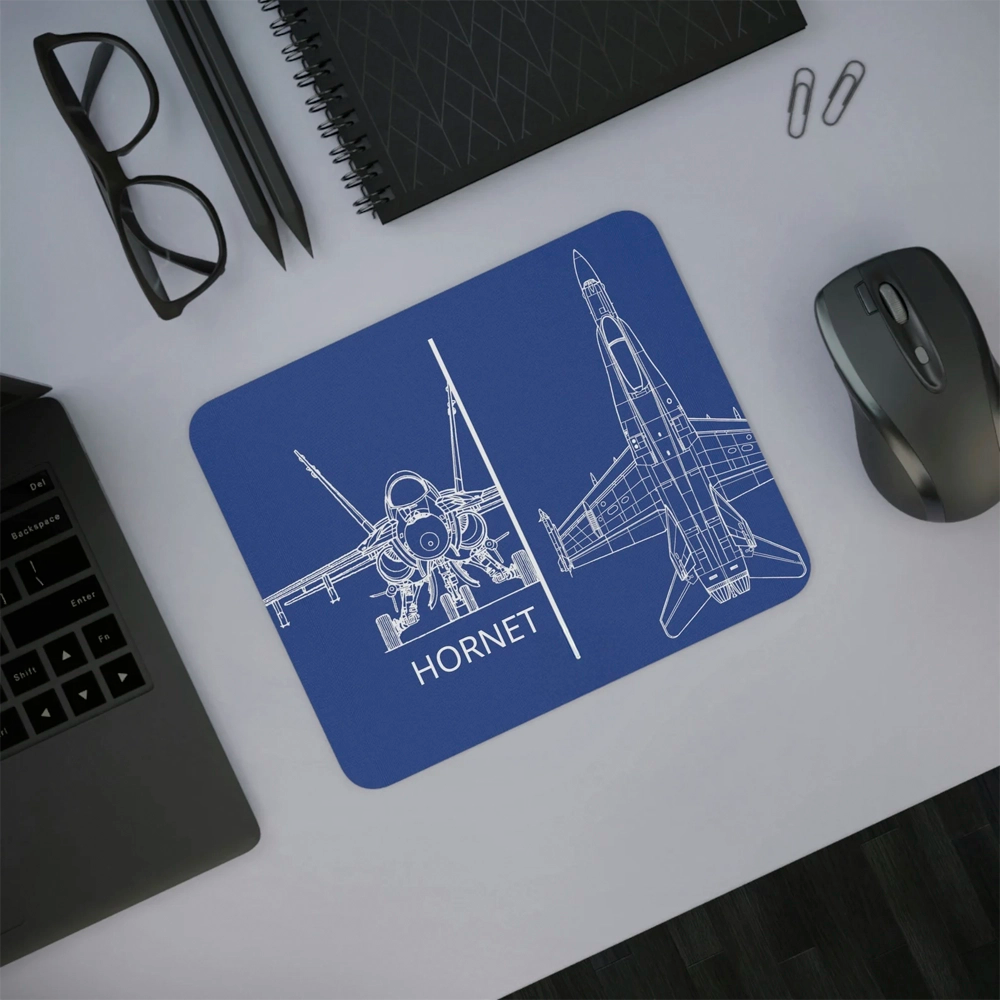 Blue mouse pad with airplane design and 'Hornet' text on a desk with laptop, mouse, and glasses.