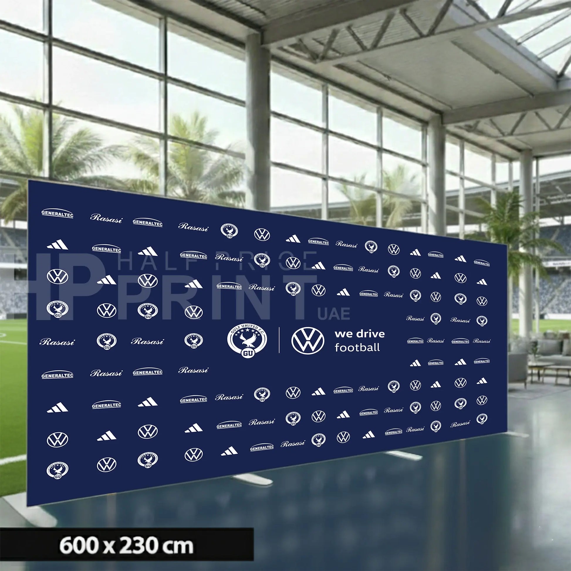Large blue fabric backdrop with various brand logos displayed indoors.