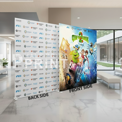 Promotional fabric backdrop display with Shrek movie poster on one side and branded backdrop on the other in a modern indoor setting.