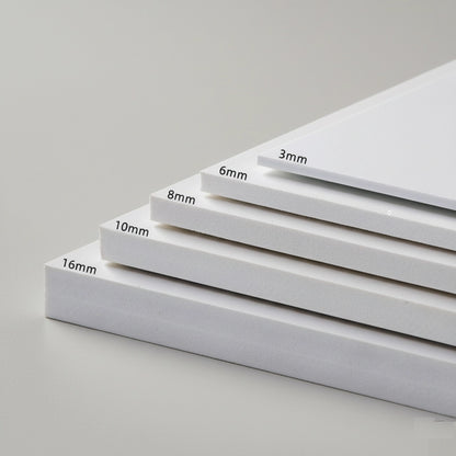 Stack of white sheets with thickness measurements on a gray background