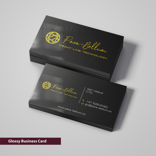 glossy business cards with gold text and logo on a gray background