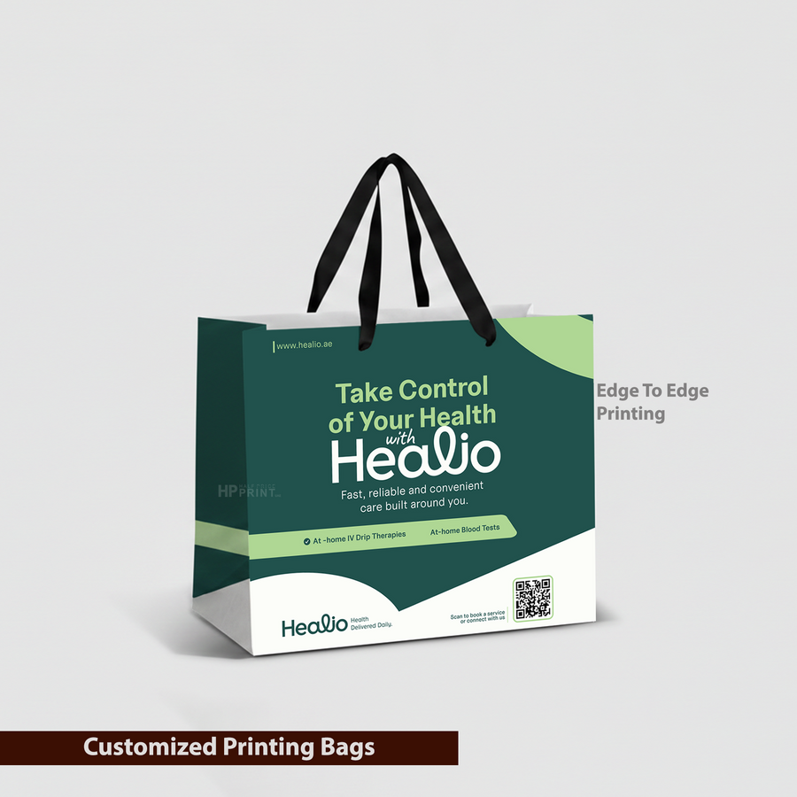 Green and white shopping paper bag with 'Healio' branding on a gray background