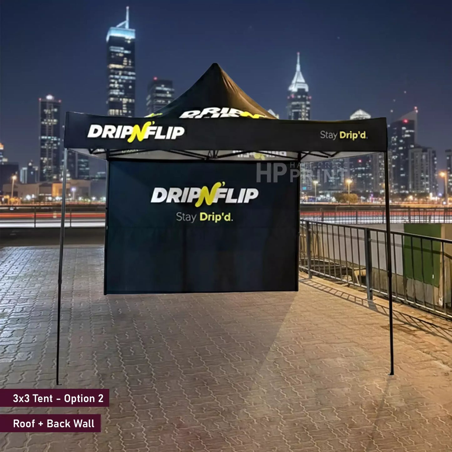 DripNFlip tent with city skyline in the background