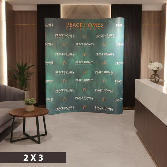 Peace Homes Development curved pop up display in a room with furniture and decor