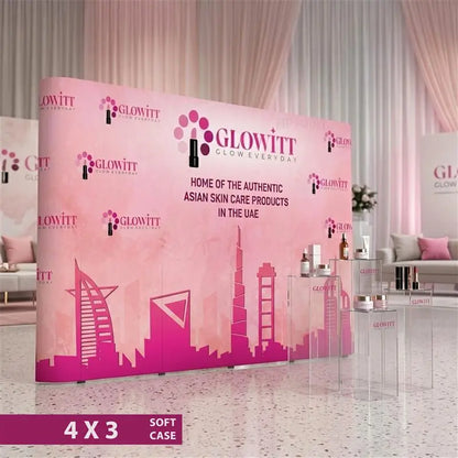 Pink pop-up display stand with Glowitt branding in a room setting