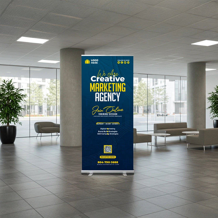 Roll-up banner in a modern office lobby with blue and yellow design.
