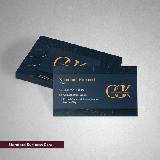 Standard business card with gold accents on a gray background