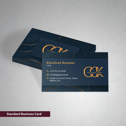 Standard business card with gold accents on a gray background