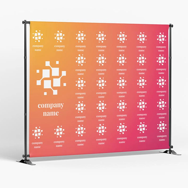 A step and repeat backdrop banner with a geometric pattern and company logos, intended for use at indoor events such as exhibitions and conferences.