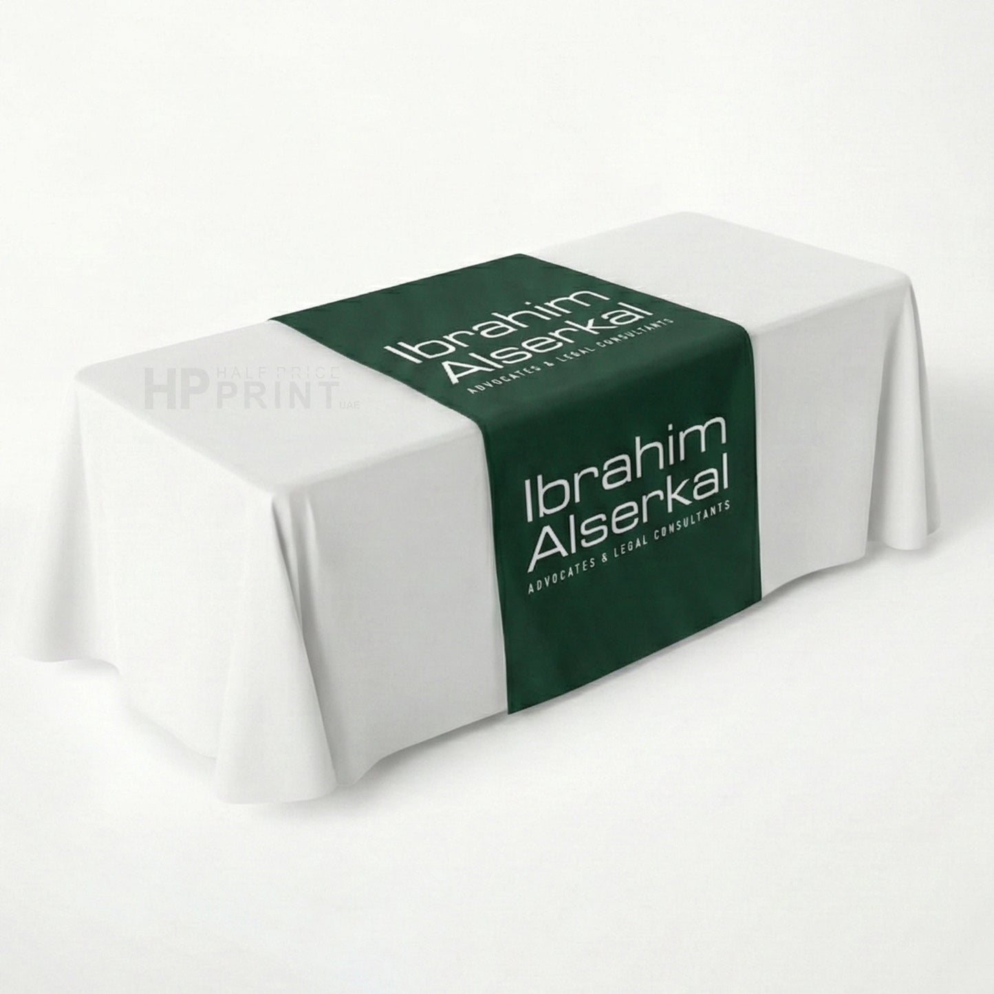 Table runner with 'Ibrahim Alserkal' branding on a white background