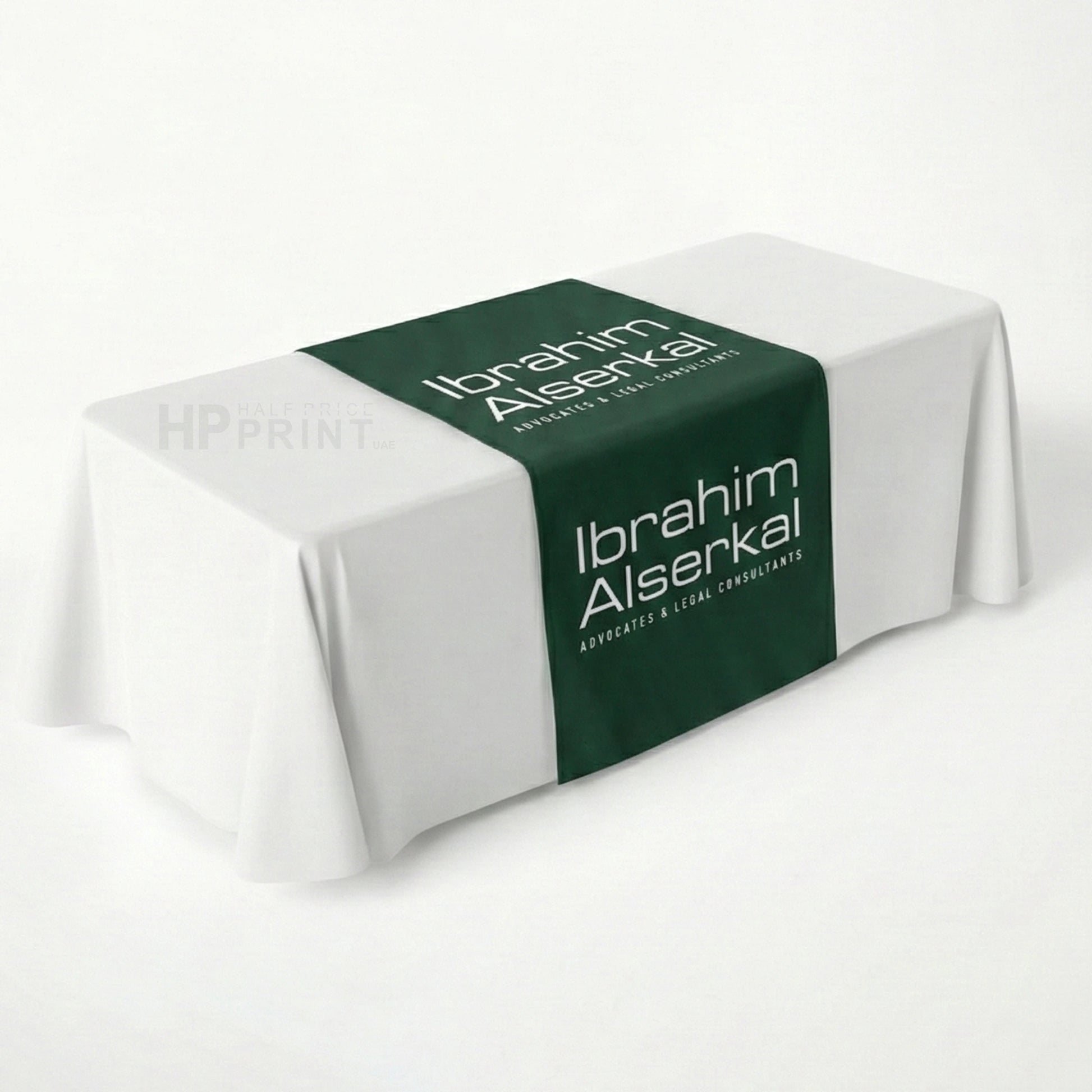 Table runner with 'Ibrahim Alserkal' branding on a white background