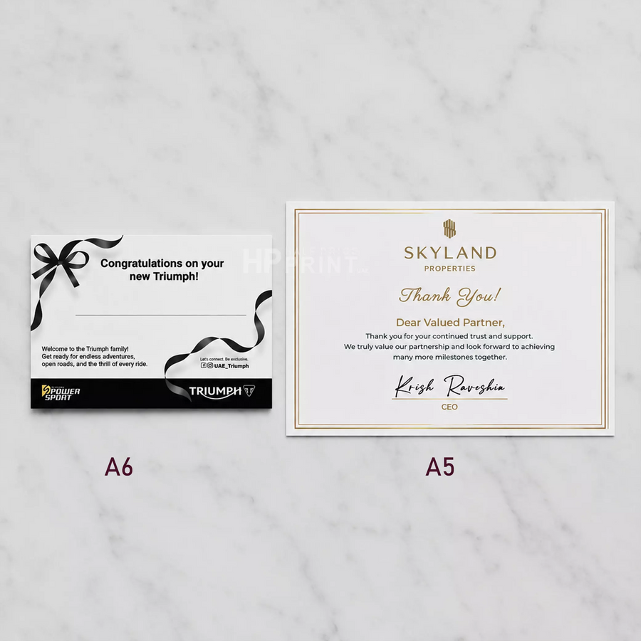 Two branded thank you cards on a marble surface, one labeled A6 and the other A5.