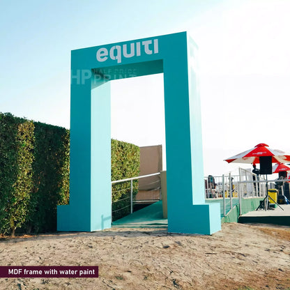 Teal archway with 'equiti' branding in an outdoor setting