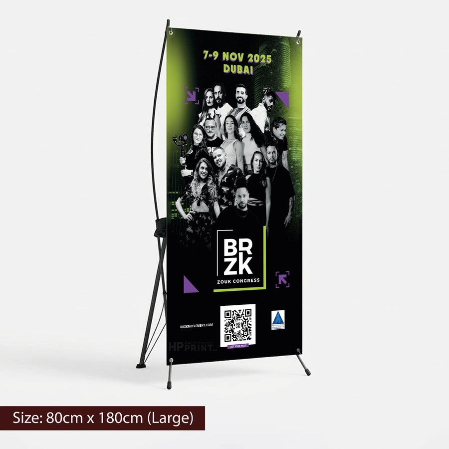 X banner for an event featuring a group of people, with branding and QR code on a stand.